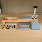 Joyrider H80 studio Pilates reformer black cushion, three-quarter angle view