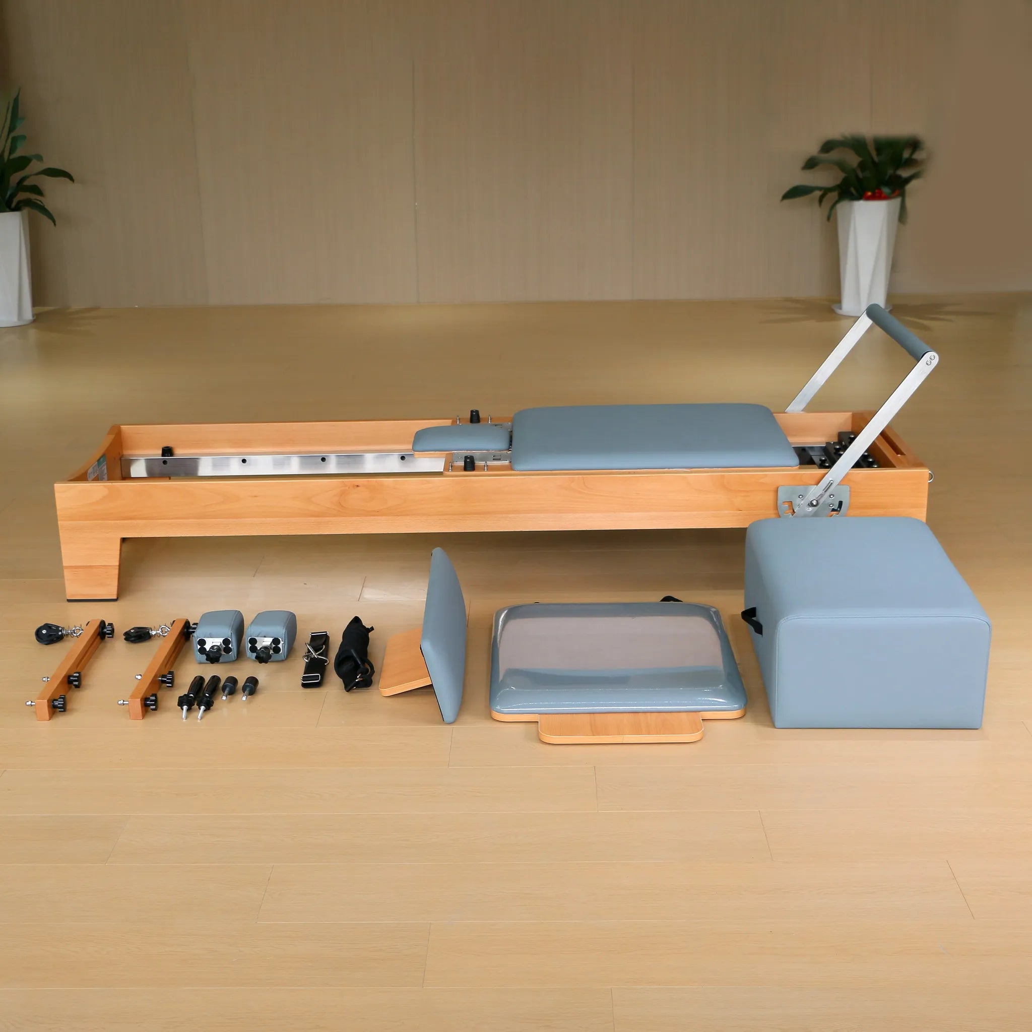 Joyrider H80 studio Pilates reformer black cushion, three-quarter angle view