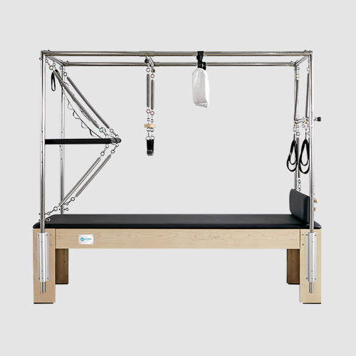 Joyrider Pilates Cadillac reformer machine with trapeze tower