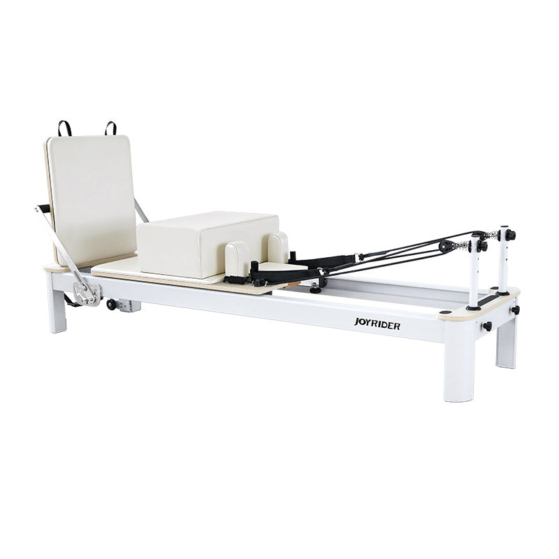 White Pilates reformer on a white